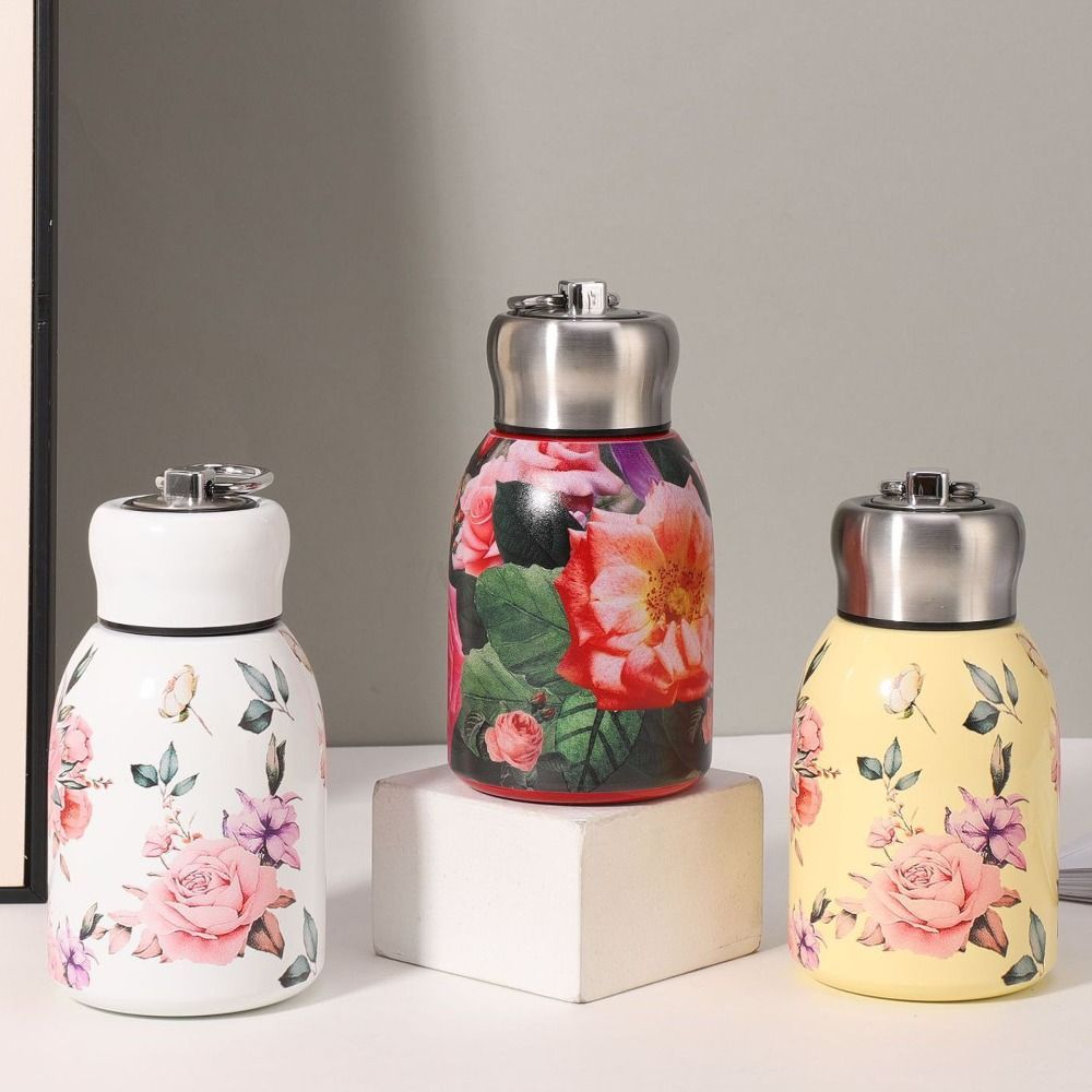 Gourde Nila 300 ml jaune avec motifs fleuris, compacte et isotherme