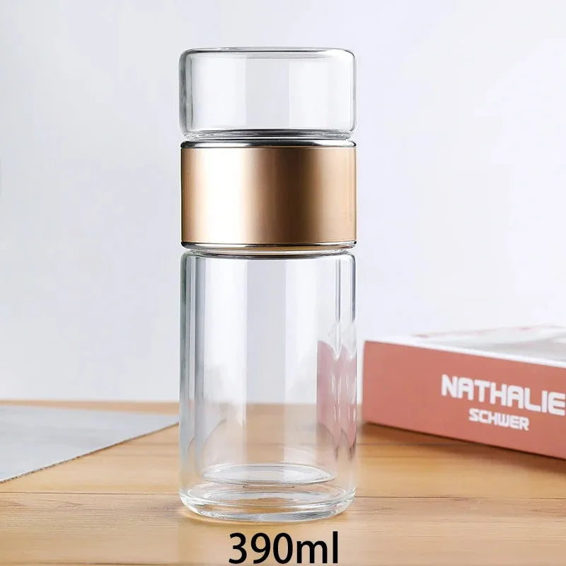 Gourde en verre avec infuseur TEVA 390 ml — bague dorée et verre vide.