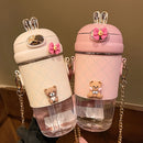 Gourde Lapi 580 ml rose avec oreilles de lapin et paille intégrée, polypropylène sans BPA